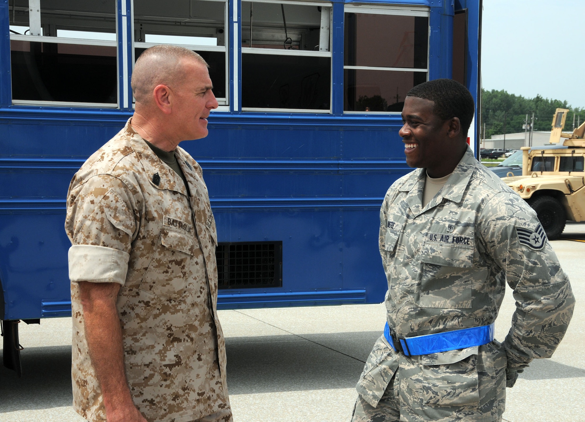 Staff Sgt. Joshua Minefee, a medical materiel journeyman with the 445th Aeromedical Staging Squadron, talks to Marine Corps Sgt. Maj. Bryan B. Battaglia, the senior enlisted advisor to the chairman of the Joint Chiefs of Staff, about his role in ASTS during Battaglia’s visit to the 445th Airlift Wing July 11, 2015. During his visit, Battaglia toured a C-17 Globemaster III, participated in demonstrations by the 445th Aeromedical Evacuation Squadron and ASTS and watched the 87th Aerial Port Squadron load cargo onto the aircraft. (U.S. Air Force photo/Tech. Sgt. Anthony Springer)