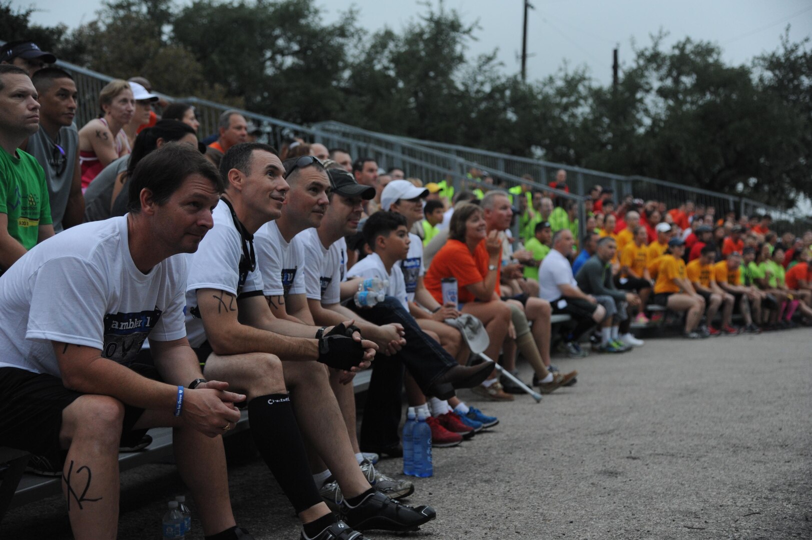 Competitors at the Rambler 120 gather for a safety briefing before the start of the race Sept. 20, 2014, at Joint Base San Antonio Recreation Park at Canyon Lake. The race included a 22-mile bike ride, 10-mile run and 2-mile raft event. (U.S. Air Force photo by Airman 1st Class Stormy Archer)