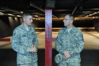 Staff Sgt. Benjamin Dunning, 902nd Security Forces Squadron armory NCO in charge, speaks to Chief Master Sgt. Stanley Cadell, 502nd Air Base Wing and Joint Base San Antonio command chief, Monday at the JBSA-Randolph firing range. Cadell serves as principal advisor to the commander for installation support functions to three primary locations (JBSA-Fort Sam Houston, JBSA-Randolph and JBSA-Lackland), supporting 90,000 military and civilian employees within the largest single installation support enterprise in the Department of Defense. (U.S. Air Force photo by Joel Martinez/Released)
