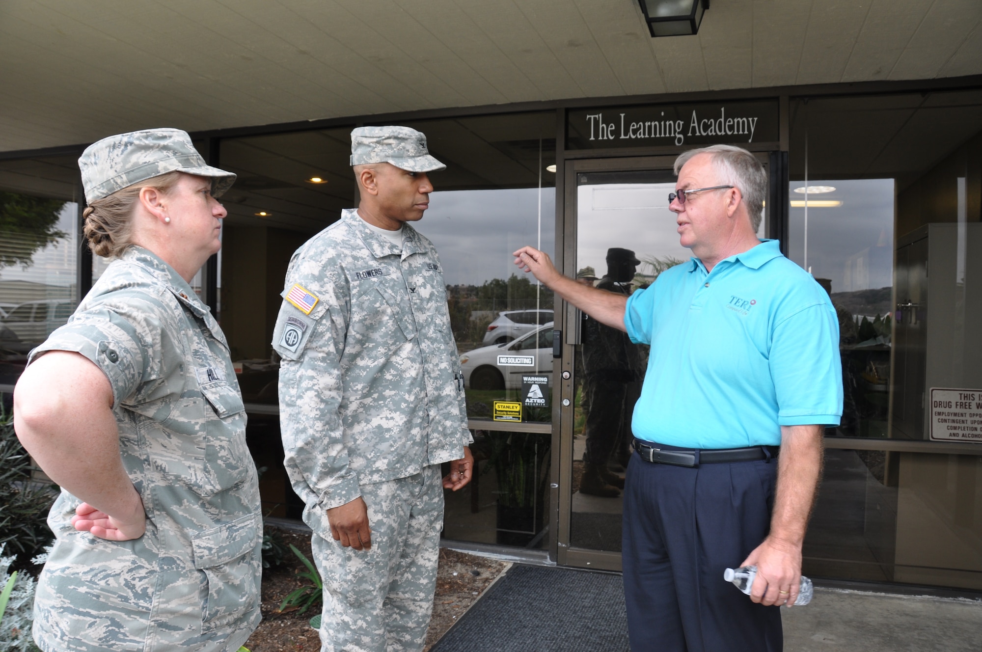 Innovative Readiness Training  leaders, Col. Eric Flowers and Maj. Anna Hill, listen as Bill Hopkins, Director of Art, describes the art programs at TERI. (U.S. Air Force photo/ Capt. Meghan Liemburg-Archer)