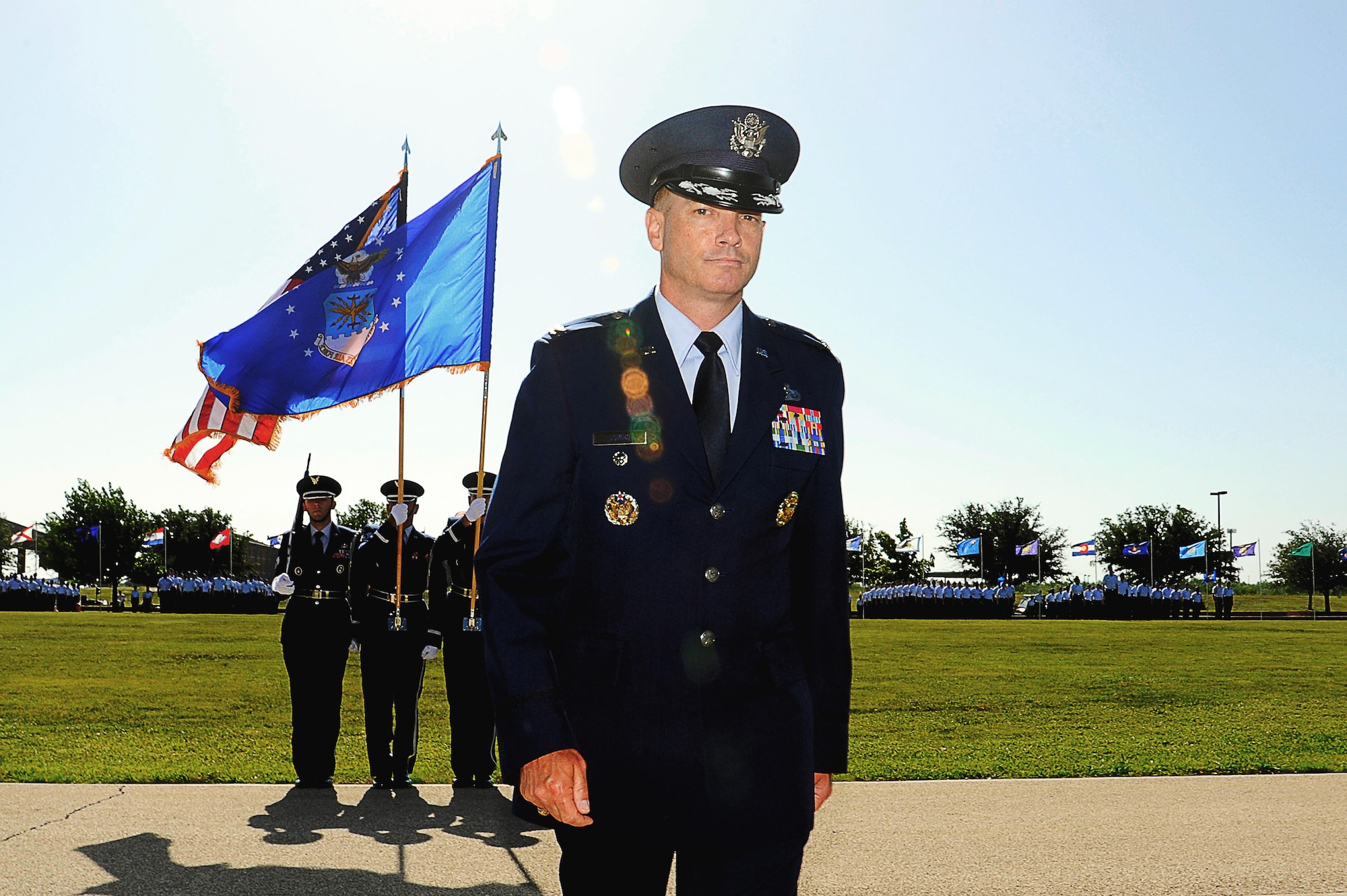 U.S. Air Force Col. Michael L. Downs, 17th Training Wing Commander, steps to the podium to address the crowd after assuming command during the 17th TRW Change of Command Ceremony at the parade field on Goodfellow Air Force Base, Texas, July 14, 2015. Downs is the 45th base commander and commands four groups, including three geographically separated units, with the mission to develop exceptional Intelligence, Surveillance and Reconnaissance and Fire Protection Professionals for America and Her Allies.  (U.S. Air Force photo by Tech. Sgt. Austin Knox/Released)