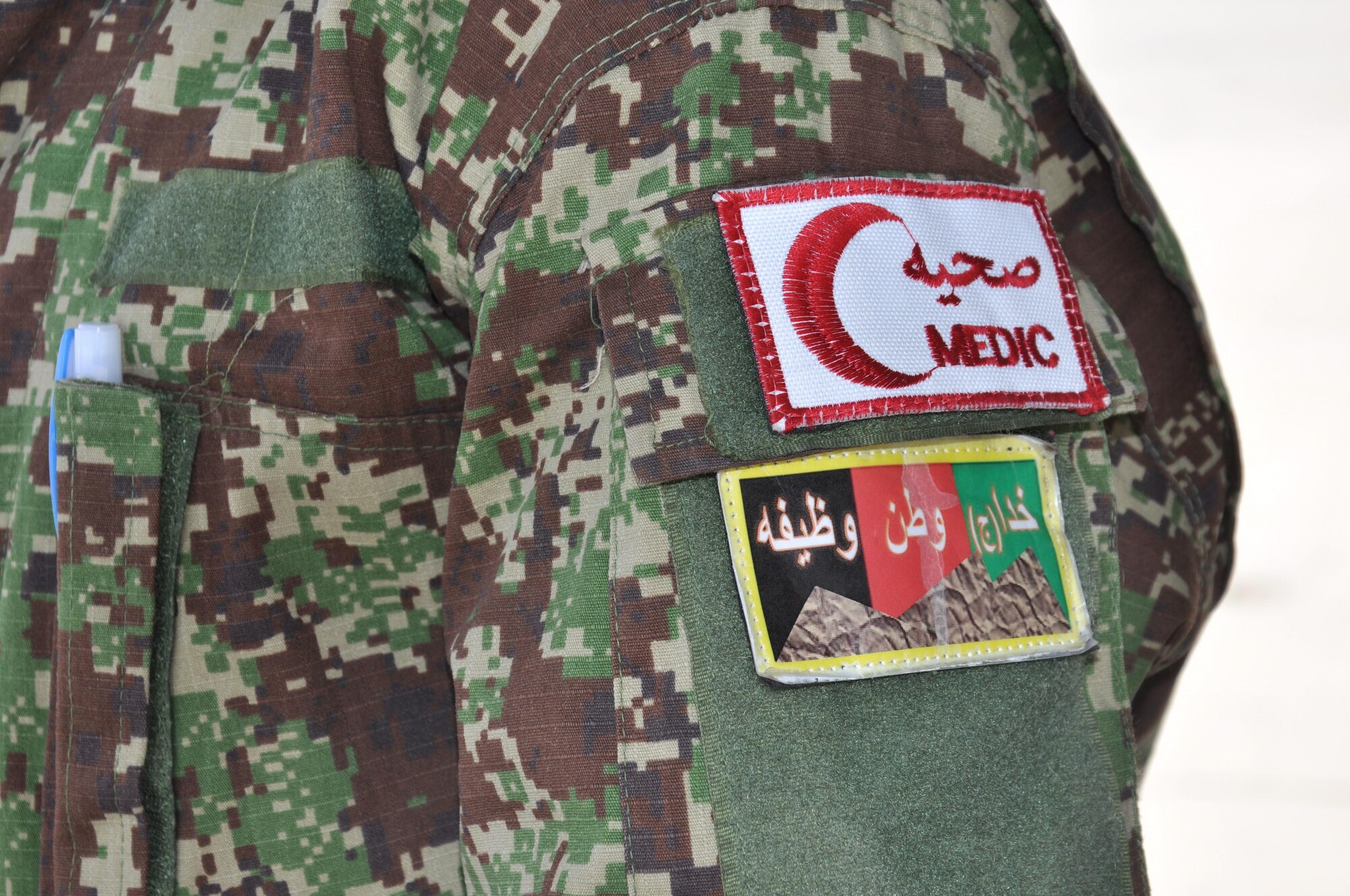 The Afghan National Army "medic" patch on the sleeve of an ANA flight medic's shoulder at Hamid Karzai International Airport, July 9, 2015. Afghan flight medics are fully trained on aeromedical evacuation. The Train, Advise, Assist Command - Air (TAAC-Air) advisers works to add to that knowledge in their weekly training sessions. (U.S. Air Force photo/Capt. Eydie Sakura/released)