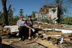 Joe Potter sits with his mother, Kate Potter, in front of what is left of her
home in Springfield, Mass., on June 2, 2011, the morning after a tornado is
believed to have gone through the area. The damage in the front yard of the
Potter home is what is left of their neighbor's home, which was completely
destroyed.