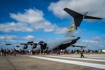 Air-show visitors wait in line to get a tour of the Charleston based C-17 at Royal Naval Air Station Yeovilton International Air Day July 11, 2015. Recognized for “Best Static Display” at the air show, Airmen from the 315th Airlift Wing at Joint Base Charleston, S.C. delivered military pride, strength and technology with a C-17 and gave tours of the aircraft to more than 2,000 people. The air show marked 75 years of existence for RNAS Yeovilton and provided the 315th AW an international stage to showcase its Airmen, aircraft and partnership with the United Kingdom. (U.S. Air Force photo by Tech. Sgt. Shane Ellis)