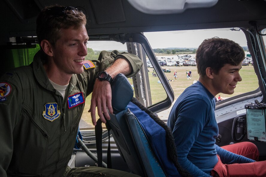 1st Lt. Ryan Grant gives a tour in the cockpit of a C-17 at Royal Naval Air Station Yeovilton International Air Day July 11, 2015. Recognized for “Best Static Display” at the air show, Airmen from the 315th Airlift Wing at Joint Base Charleston, S.C. delivered military pride, strength and technology with a C-17 and gave tours of the aircraft to more than 2,000 people. The air show marked 75 years of existence for RNAS Yeovilton and provided the 315th AW an international stage to showcase its Airmen, aircraft and partnership with the United Kingdom. Grant is a pilot with the 701st Airlift Squadron.  (U.S. Air Force photo by Tech. Sgt. Shane Ellis)