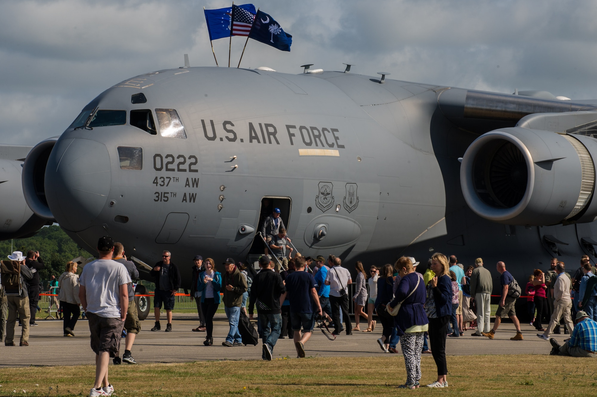 Air-show visitors get an up-close look of a Charleston based C-17 at Royal Naval Air Station Yeovilton International Air Day July 11, 2015. Recognized for “Best Static Display” at the air show, Airmen from the 315th Airlift Wing at Joint Base Charleston, S.C. delivered military pride, strength and technology with a C-17 and gave tours of the aircraft to more than 2,000 people. The air show marked 75 years of existence for RNAS Yeovilton and provided the 315th AW an international stage to showcase its Airmen, aircraft and partnership with the United Kingdom. (U.S. Air Force photo by Tech. Sgt. Shane Ellis)