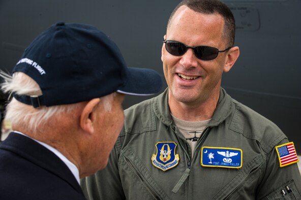 Tech. Sgt. James Fuller talks with a visitor at Royal Naval Air Station Yeovilton International Air Day July 11, 2015. Recognized for “Best Static Display” at the air show, Airmen from the 315th Airlift Wing at Joint Base Charleston, S.C. delivered military pride, strength and technology with a C-17 and gave tours of the aircraft to more than 2,000 people. The air show marked 75 years of existence for RNAS Yeovilton and provided the 315th AW an international stage to showcase its Airmen, aircraft and partnership with the United Kingdom. Fuller is a loadmaster with the 300th Airlift Squadron. (U.S. Air Force photo by Tech. Sgt. Shane Ellis)