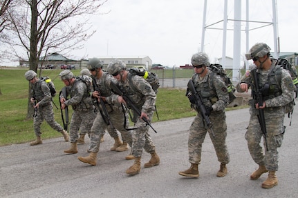 The 807th Medical Command best warrior candidates begin the road march at Wendell H. Ford Regional Training Center near Greenville, Ky. March 24. The 807th will award the best warrior title to one noncommissioned officer and one junior enlisted Soldier to compete in the US Army Reserve Command Best Warrior competition.  (U.S. Army Photo by Sgt. 1st Class Adam Stone)