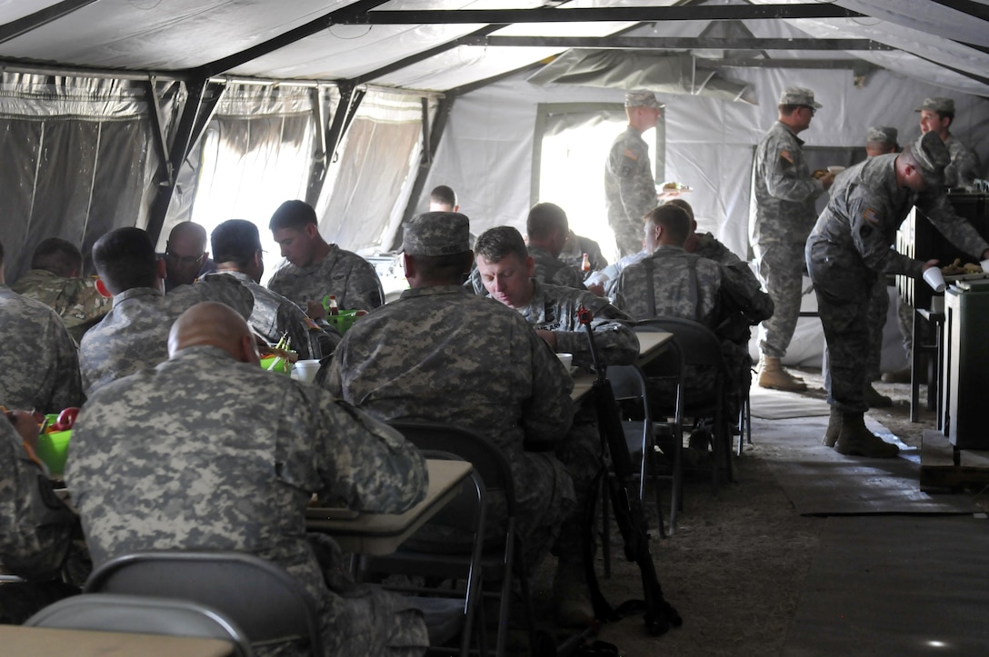 Soldiers from the 172nd Multifunctional Medical Battalion and sister units under the 807th Medical Command (Deployment Support) enjoy a lunch meal at the end of the Army Reserve-level Philip A. Connolly program competition, which the 172nd was competing in. The Connolly event evaluates units against Army food service standards of excellence governed by approximately 24 different Army regulations, field manuals, and Department of the Army pamphlets.