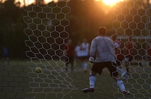 Airman 1st class Shane Landon, 823rd Red Horse Squadron team goalie, blocks a potential goal during an intramural soccer game at Hurlburt Field, Fla., July 13, 2015. The 823rd RHS and the joint 1st Special Operations Component and Equipment Maintenance Squadrons tied 2-2 after one overtime round in the 2nd week of league play. There are 15 squadrons participating this season and regular season play is scheduled to last until Aug. 13 2015. (U.S. Air Force photo by Airman Kai White/Released)