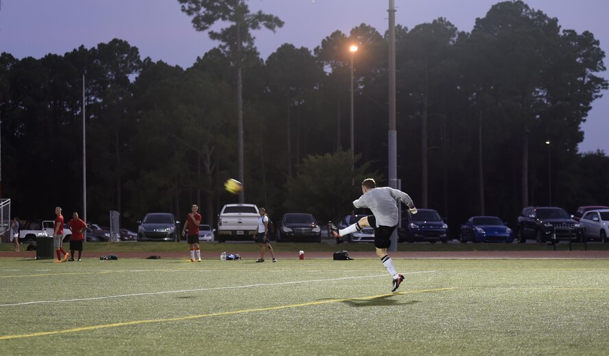 Airman 1st Class Shane Landon, 823rd Red Horse Squadron team goalie, returns a kick during an intramural soccer game at Hurlburt Field, Fla., July 13, 2015. The 823rd RHS and the joint 1st Special Operations Component and Equipment Maintenance Squadrons tied 2-2 after one overtime round in the 2nd week of league play. There are 15 squadrons participating this season and regular season play is scheduled to last until Aug. 13 2015. (U.S. Air Force photo by Airman Kai White/Released)