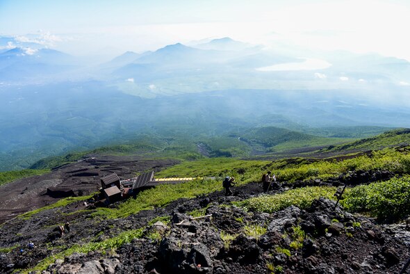 Hikers make their way up the Yoshida trail on their way to the summit of Mount Fuji, Japan, July 11, 2015. Airmen from Yokota Air Base used teamwork and resiliency to make sure that all members returned safely from the mountain. (U.S. Air Force photo/Airman 1st Class Elizabeth Baker)