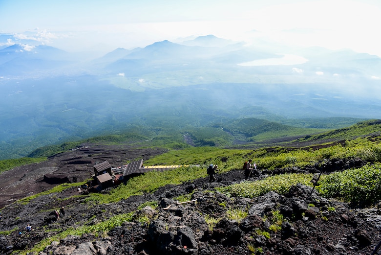 Hikers make their way up the Yoshida trail on their way to the summit of Mount Fuji, Japan, July 11, 2015. Airmen from Yokota Air Base used teamwork and resiliency to make sure that all members returned safely from the mountain. (U.S. Air Force photo/Airman 1st Class Elizabeth Baker)