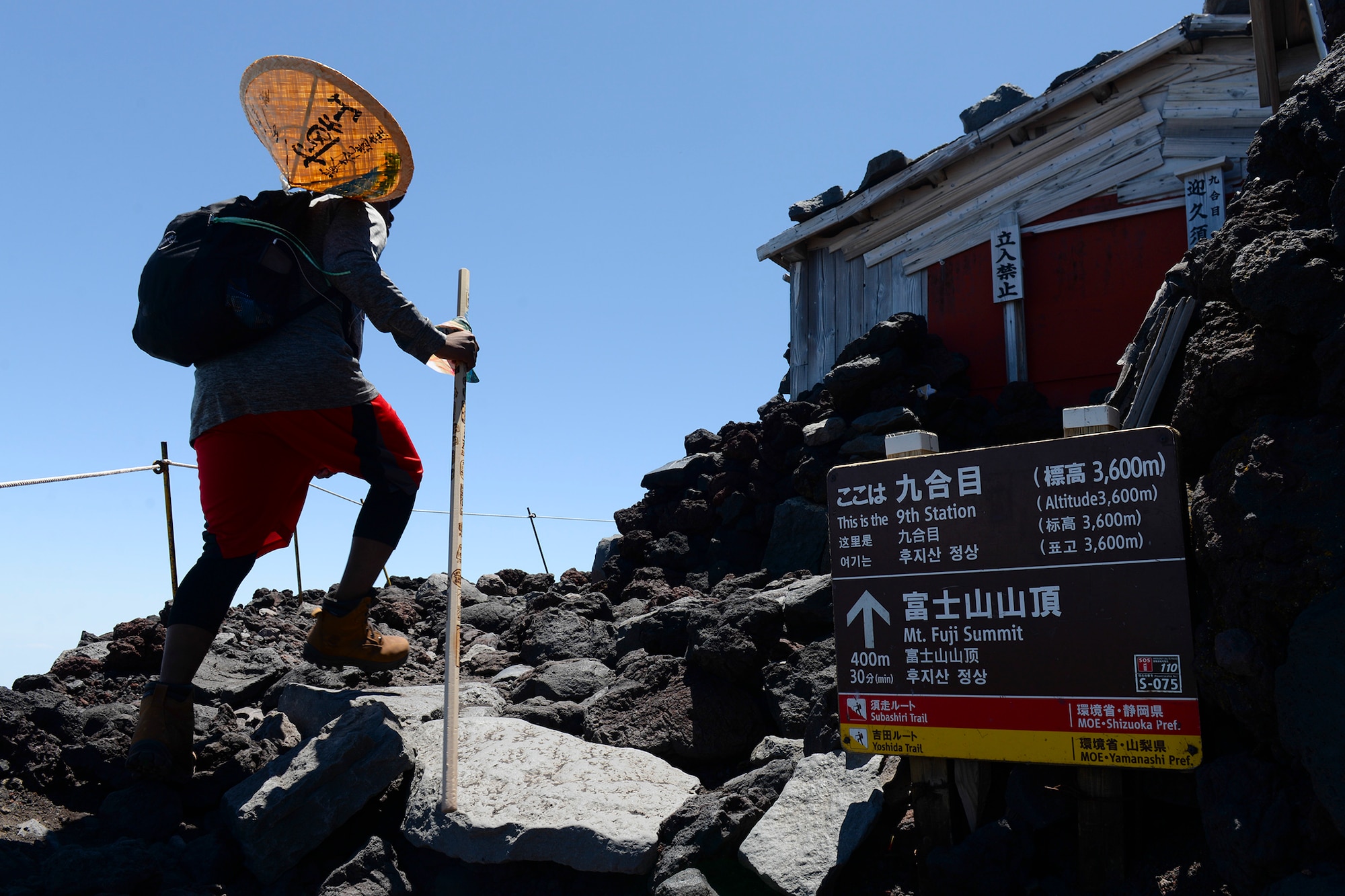 A hiker makes his way past the ninth station of the Yoshida trail on Mount Fuji, Japan, July 11, 2015. To reach the summit of Mount Fuji, hikers had to climb over 5,000 feet, taking anywhere from three to seven hours. Airmen from Yokota Air Base used teamwork and resiliency to make sure that all members returned safely from the mountain. (U.S. Air Force photo/Airman 1st Class Elizabeth Baker)