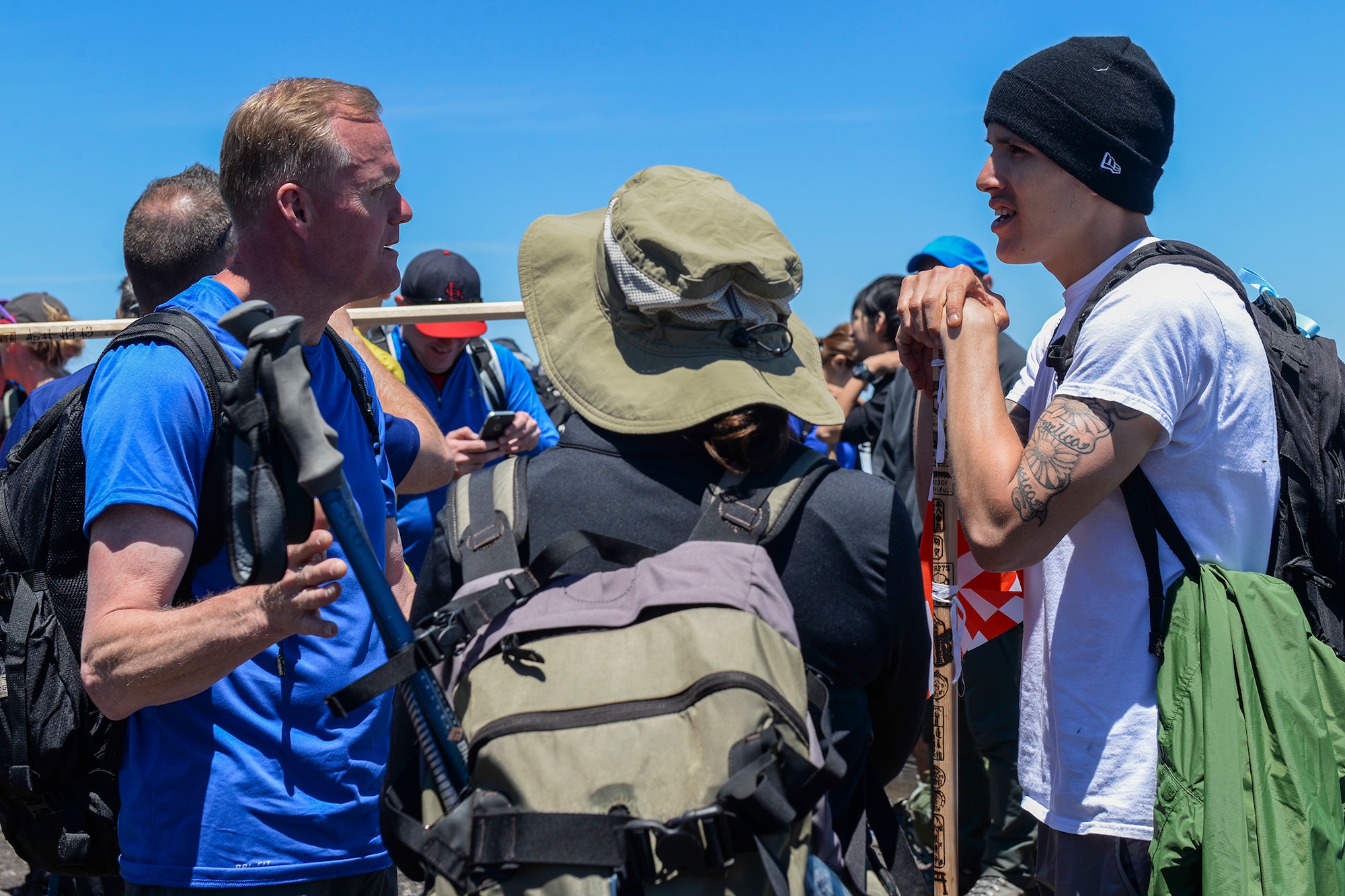 Chief Master Sgt. of the Air Force James A. Cody talks with Airmen after climbing to the summit of Mount Fuji, Japan, July 11, 2015. After climbing to the summit, Cody spent time socializing with the rest of the hikers. (U.S. Air Force photo/Airman 1st Class Elizabeth Baker)