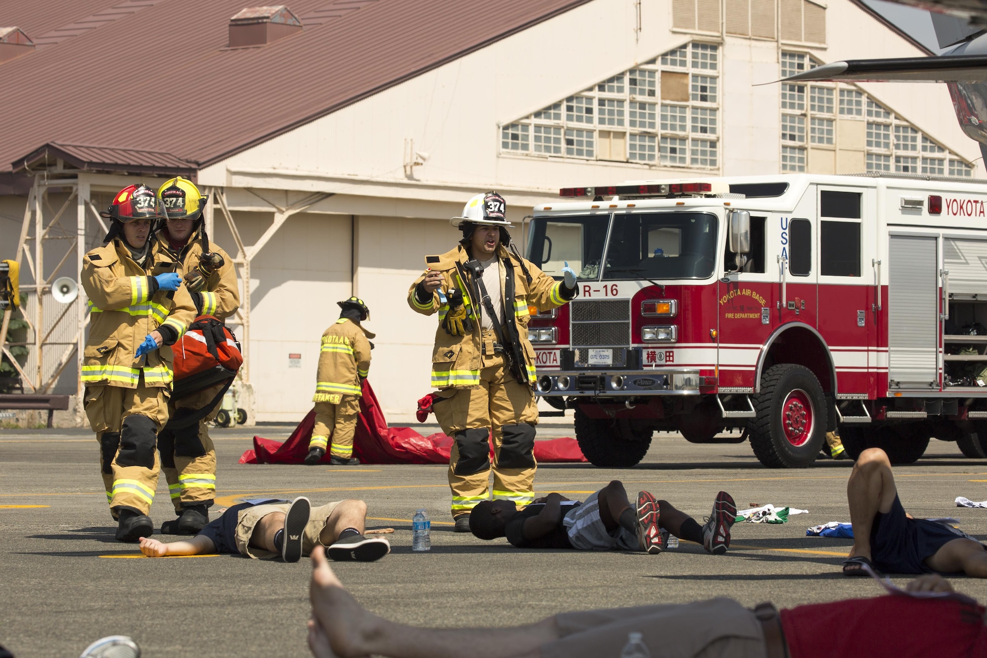 Yokota firefighters arrive on scene during an Emergency Management Exercise at Yokota Air Base, July 13, 2015. First responders have an essential role in exercises and real-world situations, and they continue to train to ensure preparedness for any situation. (U.S. Air Force photo by Osakabe Yasuo/Released) 
