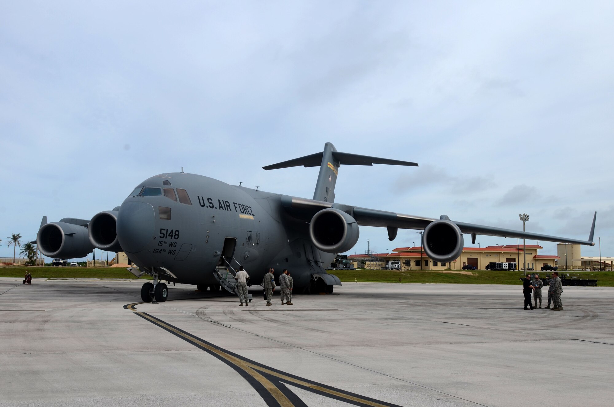 A C-17 Globemaster III assigned to the Hawaii Air National Guard at Joint Base Pearl Harbor-Hickam, Hawaii, arrives at Andersen Air Force Base, Guam, July 15, 2015, after evacuating more than 125 Department of Defense members from Wake Island in preparation for potential surges caused by Typhoon Halola. An evacuation mission such as this highlights Pacific Air Force’s flexibility to generate air response quickly across the theater, which is a key component to air power. The DoD personnel are part of the Pacific Air Forces Regional Support Center and 11th Air Force mission on Wake Island, which is a strategic location within the Pacific and also a divert airfield for overseas flights. (U.S. Air Force photo by Airman 1st Class Alexa A. Henderson/Released)