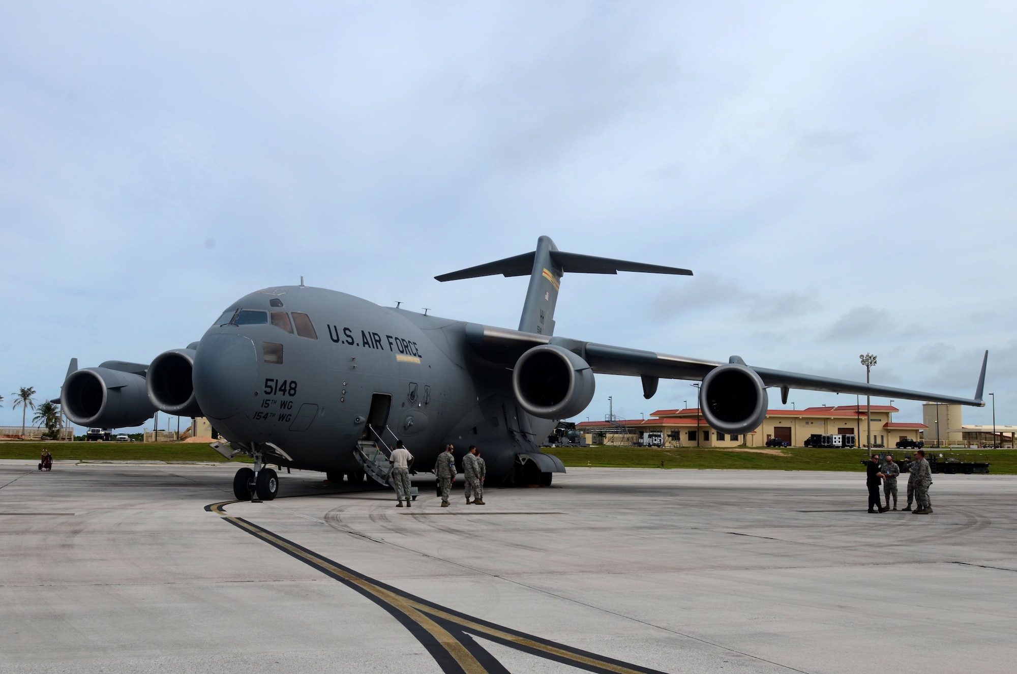 A C-17 Globemaster III assigned to the Hawaii Air National Guard at Joint Base Pearl Harbor-Hickam, Hawaii, arrives at Andersen Air Force Base, Guam, July 15, 2015, after evacuating more than 125 Department of Defense members from Wake Island in preparation for potential surges caused by Typhoon Halola. An evacuation mission such as this highlights Pacific Air Force’s flexibility to generate air response quickly across the theater, which is a key component to air power. The DoD personnel are part of the Pacific Air Forces Regional Support Center and 11th Air Force mission on Wake Island, which is a strategic location within the Pacific and also a divert airfield for overseas flights. (U.S. Air Force photo by Airman 1st Class Alexa A. Henderson/Released)