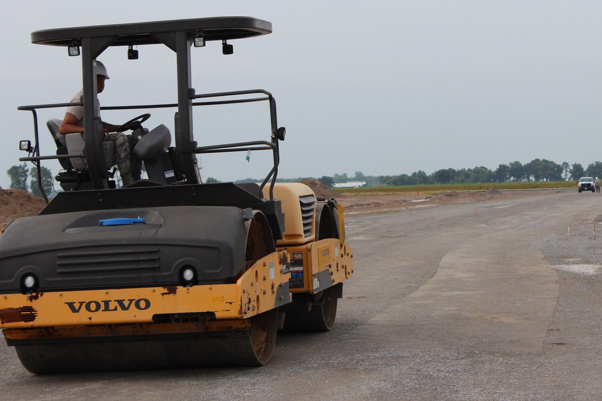 A U.S. Air Force Airmen with the 307th Civil Engineer Squadron grades a runway for the airport in Clarksdale, Miss., June 29, 2015.   The 307th CES and 301st CES teamed up to work on the airport as part of the Air Force Reserve Command's Innovative Readiness Training initiative.   The program allows AFRC units to help underserved communities while gaining training experience.  (U.S. Air Force photo by Senior Airman Rodney Gibson/released)