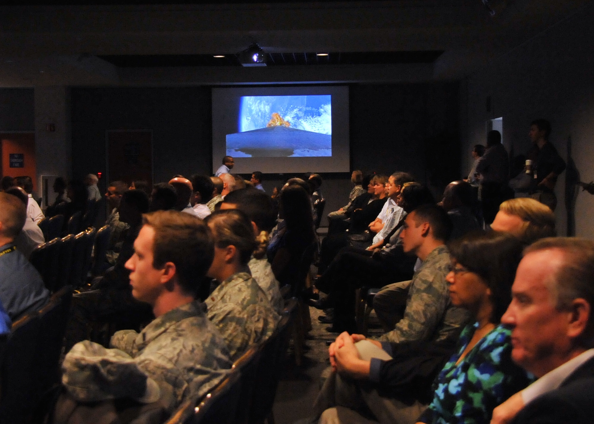 An audience of more than 150 Space and Missile Systems Center personnel watch the on-board camera perspective of the first stage performance of an Atlas V in the Gordon Conference Center at Los Angeles Air Force Base in El Segundo, Calif. On July 15, 2015, a United Launch Alliance Atlas V in the “401” vehicle configuration of a four-meter-wide payload fairing, zero solid rocket boosters and a single engine upper stage successfully carried a GPS IIF-10 satellite into orbit at 11:36 a.m. EDT from Launch Complex 41 at Cape Canaveral Air Force Station in Florida for the Global Positioning System navigation network. (U.S. Air Force photo/Sarah Corrice)