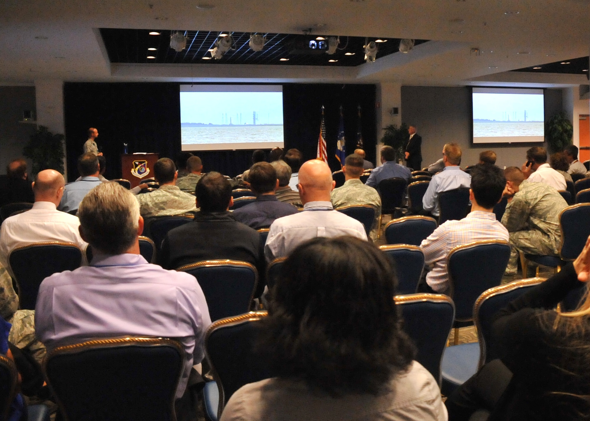 An audience of more than 150 Space and Missile Systems Center personnel intently watch the terminal countdown of an Atlas V in the Gordon Conference Center at Los Angeles Air Force Base in El Segundo, Calif. On July 15, 2015, a United Launch Alliance Atlas V in the “401” vehicle configuration of a four-meter-wide payload fairing, zero solid rocket boosters and a single engine upper stage successfully carried a GPS IIF-10 satellite into orbit at 11:36 a.m. EDT from Launch Complex 41 at Cape Canaveral Air Force Station in Florida for the Global Positioning System navigation network. (U.S. Air Force photo/Sarah Corrice)