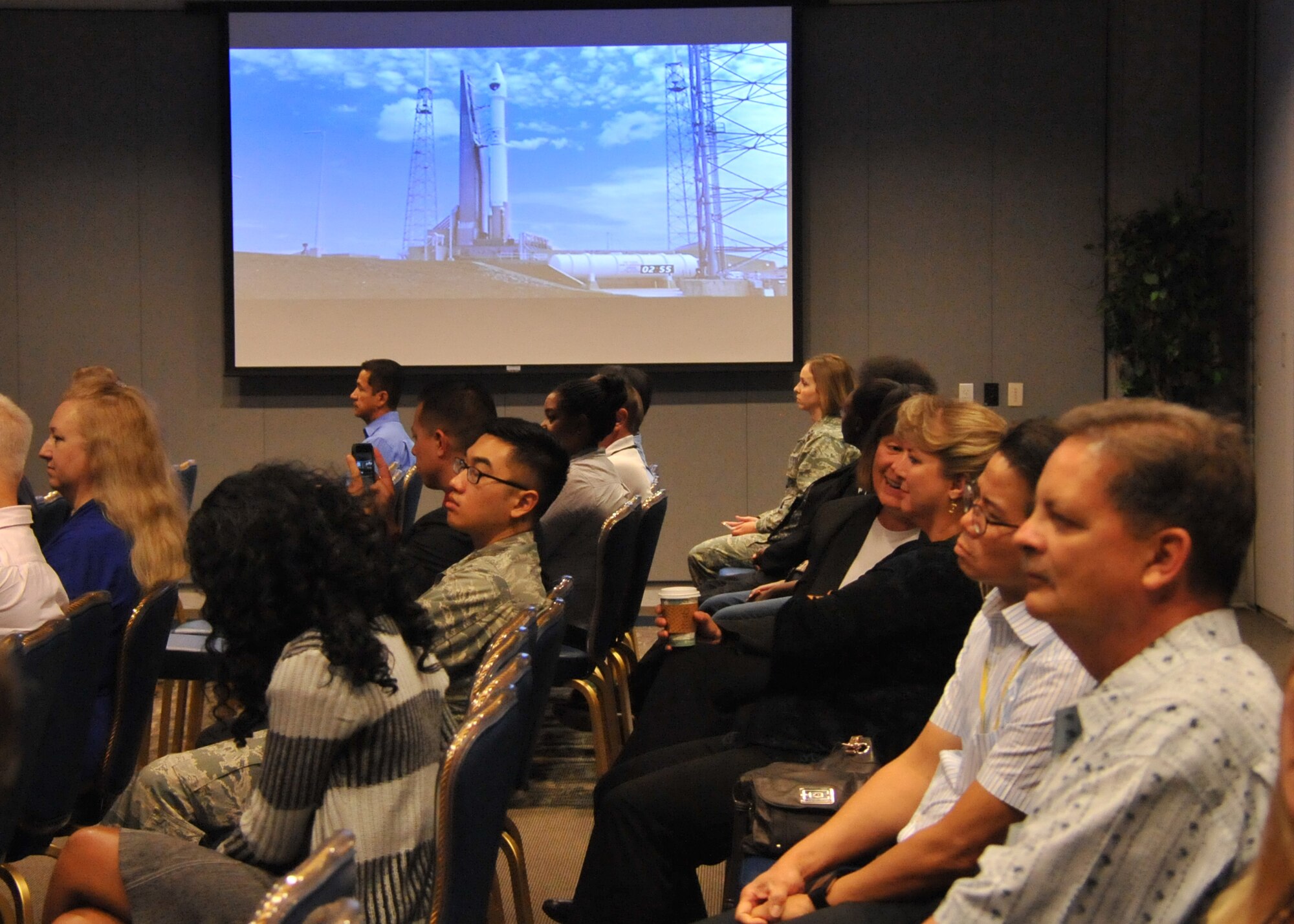 An audience of more than 150 Space and Missile Systems Center personnel intently watch the terminal countdown of an Atlas V in the Gordon Conference Center at Los Angeles Air Force Base in El Segundo, Calif. On July 15, 2015, a United Launch Alliance Atlas V in the “401” vehicle configuration of a four-meter-wide payload fairing, zero solid rocket boosters and a single engine upper stage successfully carried a GPS IIF-10 satellite into orbit at 11:36 a.m. EDT from Launch Complex 41 at Cape Canaveral Air Force Station in Florida for the Global Positioning System navigation network. (U.S. Air Force photo/Sarah Corrice)