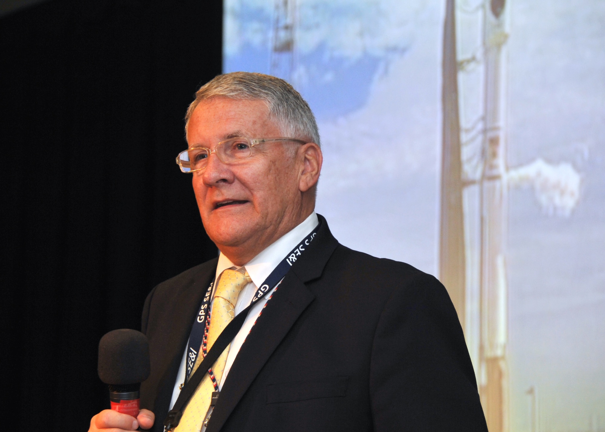R. Bruce Lagatree, GPS System Engineering and Integration Program principal systems engineer for Leidos, previously known as Science Applications International Corporation briefs an audience of more than 150 SMC personnel in the Gordon Conference Center at Los Angeles Air Force Base in El Segundo, Calif. On July 15, 2015, a United Launch Alliance Atlas V in the “401” vehicle configuration of a four-meter-wide payload fairing, zero solid rocket boosters and a single engine upper stage successfully carried a GPS IIF-10 satellite into orbit at 11:36 a.m. EDT from Launch Complex 41 at Cape Canaveral Air Force Station in Florida for the Global Positioning System navigation network. (U.S. Air Force photo/Sarah Corrice)