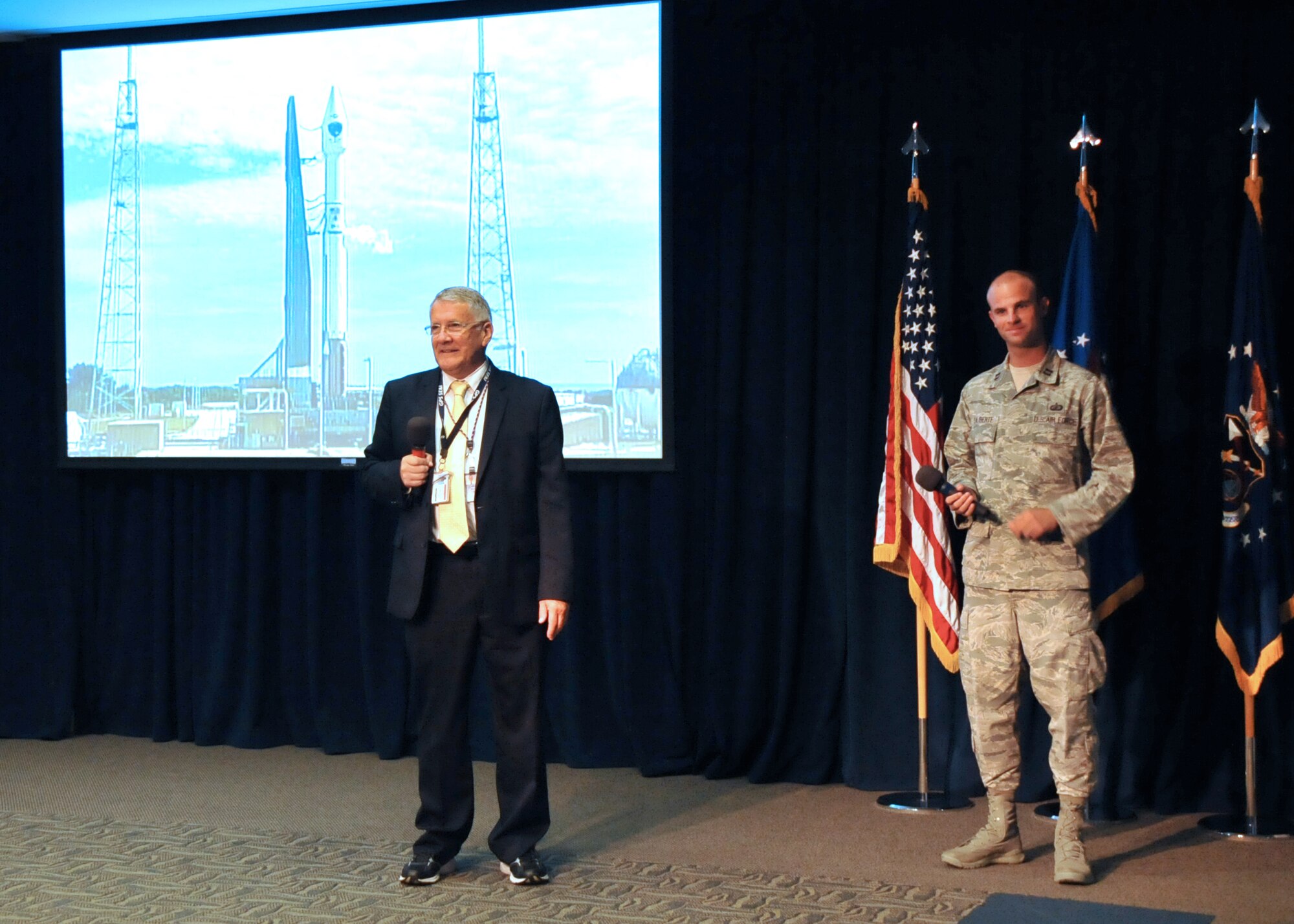 R. Bruce Lagatree, GPS System Engineering and Integration Program principal systems engineer for Leidos, previously known as Science Applications International Corporation and Capt. Nick Laliberte, Government Mission Integration Manager from the Space and Missile Systems Center’s Launch Systems Directorate fields questions from an audience of more than 150 SMC personnel in the Gordon Conference Center at Los Angeles Air Force Base in El Segundo, Calif. On July 15, 2015, a United Launch Alliance Atlas V in the “401” vehicle configuration of a four-meter-wide payload fairing, zero solid rocket boosters and a single engine upper stage successfully carried a GPS IIF-10 satellite into orbit at 11:36 a.m. EDT from Launch Complex 41 at Cape Canaveral Air Force Station in Florida for the Global Positioning System navigation network. (U.S. Air Force photo/Sarah Corrice)