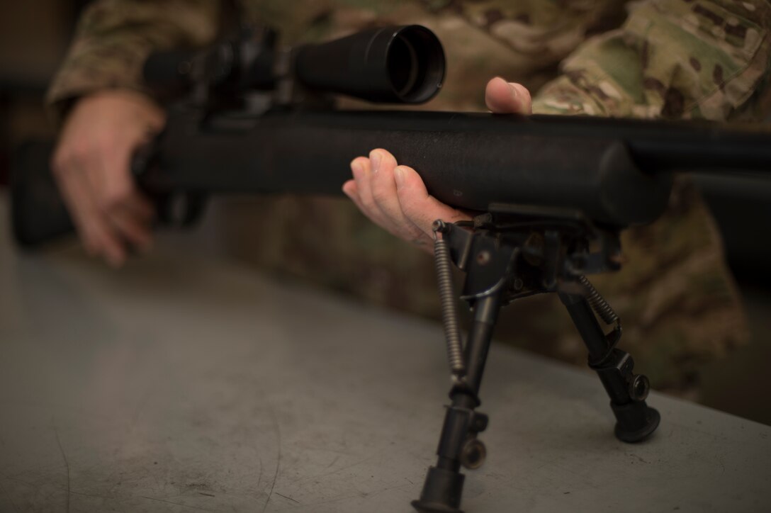 012- U.S. Air Force Staff Sgt. Joseph Crotty, 822d Base Defense Squadron NCO in charge of standards and evaluations, examines a M24 Sniper Weapon System July 2, 2015, at Moody Air Force Base, Ga. Crotty was one of two Airmen who were selected to attend the Royal Air Force’s Basic Sniper Course. (U.S. Air Force photo by Staff Sgt. Eric Summers Jr./Released)