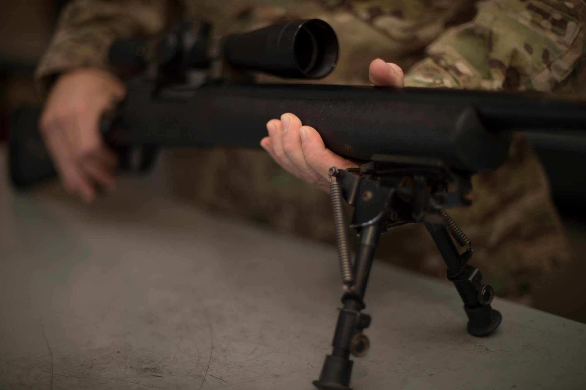 012- U.S. Air Force Staff Sgt. Joseph Crotty, 822d Base Defense Squadron NCO in charge of standards and evaluations, examines a M24 Sniper Weapon System July 2, 2015, at Moody Air Force Base, Ga. Crotty was one of two Airmen who were selected to attend the Royal Air Force’s Basic Sniper Course. (U.S. Air Force photo by Staff Sgt. Eric Summers Jr./Released)