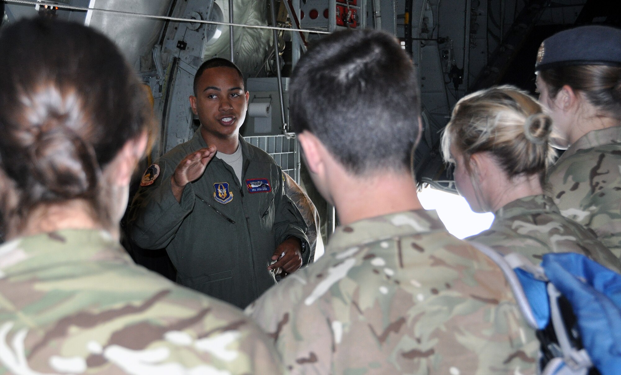 PETERSON AIR FORCE BASE, Colo. – Senior Airman Josh Winn explains some of the capabilities of an Air Force Reserve Command C-130H to Royal Air Force College cadets July 8, 2015 here. Besides the tour of the aircraft the fifteen cadets were given 302nd Airlift Wing mission and Modular Airborne Fire Fighting System briefs. The students will spend about a month in the Colorado Springs area interacting with their U.S. Air Force Academy counterparts. The exchange program is designed to increase awareness and build relationships between the countries’ two air force academies. Winn is a C-130 loadmaster with the 731st Airlift Squadron. (U.S. Air Force photo/Master Sgt. Daniel Butterfield)