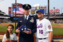 Mets second baseman, Danny Muno, posses with Capt. Michael Gielbeda, communications and information officer with the 111th Operations Support Squadron and his daughter, June 9 at Citi Field, Queens, N.Y. Gielbeda was recognized as the Veteran of the Game by the Mets and the Wounded Warrior Project during the game against the San Francisco Giants. (Image provided by Capt. Michael Gielbeda)