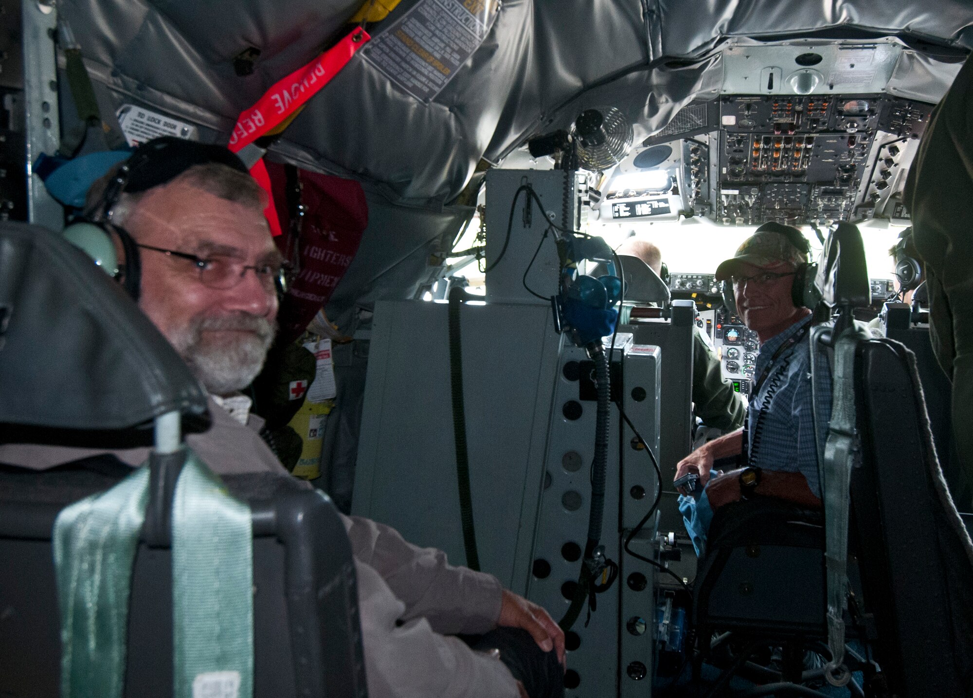 Civilian employers of National Guard and Reserve service members observe the operations inside a KC-135R Stratotanker cockpit July 14, 2015, during an ESGR Boss-lift. The ESGR Boss-lift is a day set to educate civilian employers of National Guard and Reserve service members as to what their employees accomplish while on military duty. (U.S. Air Force photo by Airman 1st Class Morgan R. Lipinski/Released)