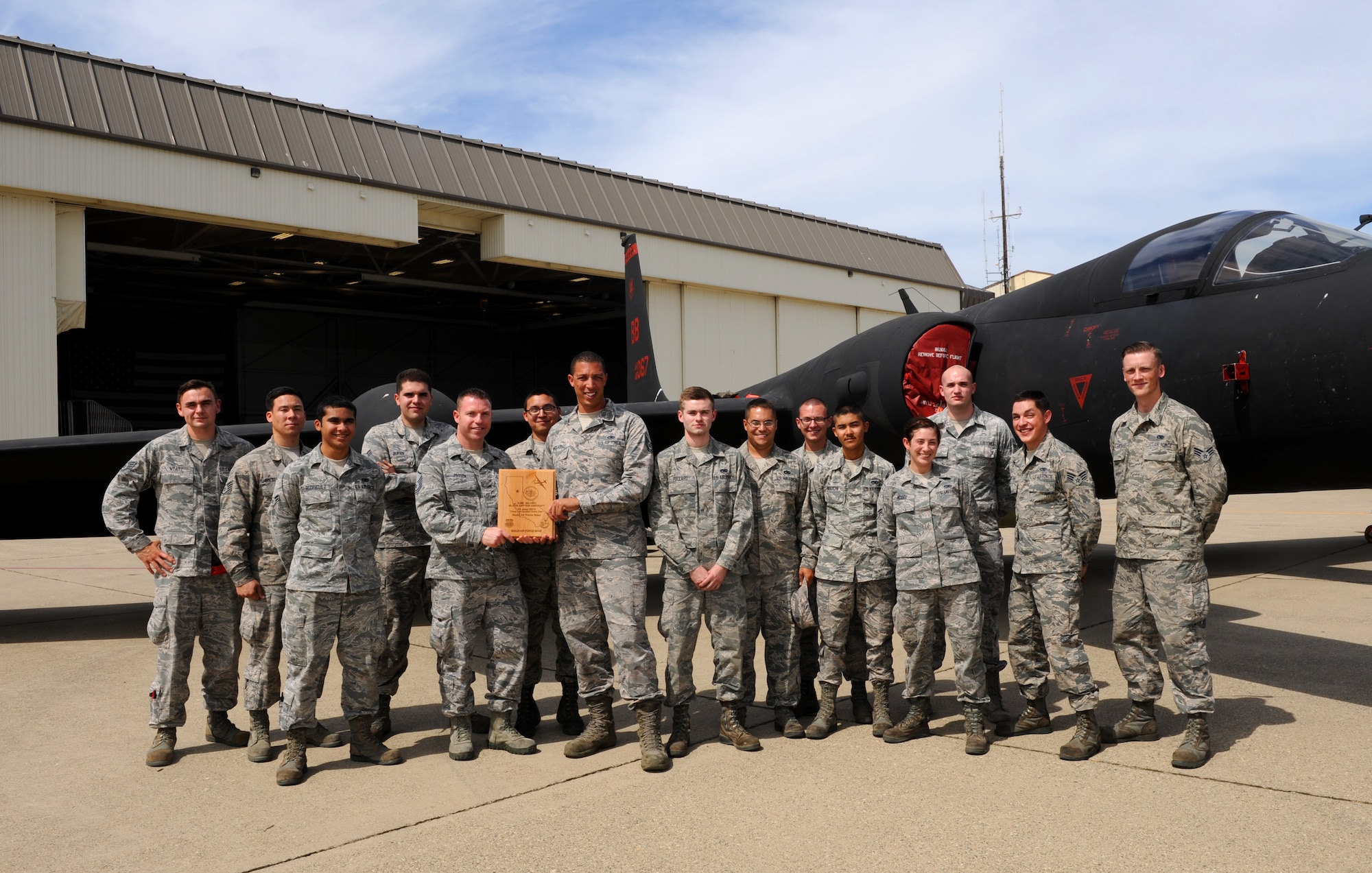 Airmen from the 9th Aircraft Maintenance Squadron pose with a U-2 Dragon Lady at Beale Air Force Base, California, July 14, 2015. The Airmen were recognized for a “black-letter jet,” a rare accomplishment in which a plane is flown with zero discrepancies. The achievement has not happened in 13 years at Beale. (U.S. Air Force photo by Airman Preston L. Cherry)