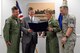 Louisiana State Senator Barrow Peacock and 2nd Bomb Wing leadership read a resolution at Barksdale Air Force Base, La., July 13, 2015. The resolution congratulates the 2nd BW for earning the 2014 Brigadier General Frederick W. Castle Award as Air Force Global Strike Command's best bomb wing of the year. Throughout 2014, the 2nd BW reformed processes which earned Air Force and Department of Defense accolades punctuated by the highest possible ratings on multiple major inspections. This is the second time 2nd BW has earned the prestigious award, the first being in 2010. 