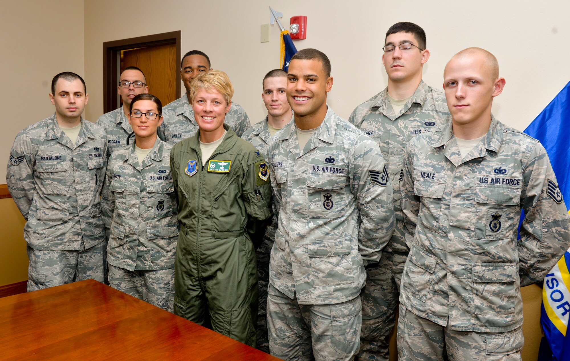 Col. Kristin Goodwin, 2nd Bomb Wing commander, poses for a photo with members from the 2nd Security Forces Squadron returning home from deployment on Barksdale Air Force Base, La, July 14. Members deployed in support of Operations Inherent Resolve and Freedom Sentinel. (U.S. Air Force photo/Airman 1st Class Mozer O. Da Cunha)