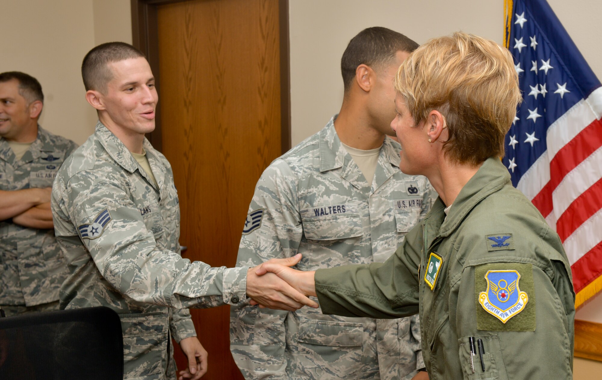 Col. Kristin Goodwin, 2nd Bomb Wing commander, welcomes home Senior Airman Brent Laws, 2nd Security Forces Squadron installation patrolman, at Barksdale Air Force Base, La., July 14, 2015. Laws returned home after a six-month deployment in support of Operations Inherent Resolve and Freedom’s Sentinel. (U.S. Air Force photo/Airman 1st Class Mozer O. Da Cunha)