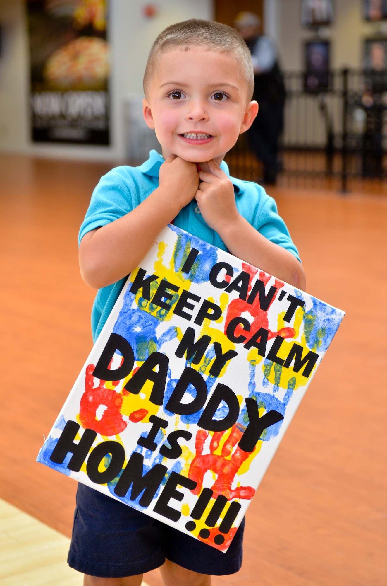 A child waits for his father at Shreveport Regional Airport, Shreveport, La., July 13, La., 2015. Members of the 2nd Security Forces Squadron returned home after a six-month long deployment to Saudi Arabia in support of Operations Inherent Resolve and Freedom’s Sentinel. (U.S. Air Force photo/Airman 1st Class Mozer O. Da Cunha)