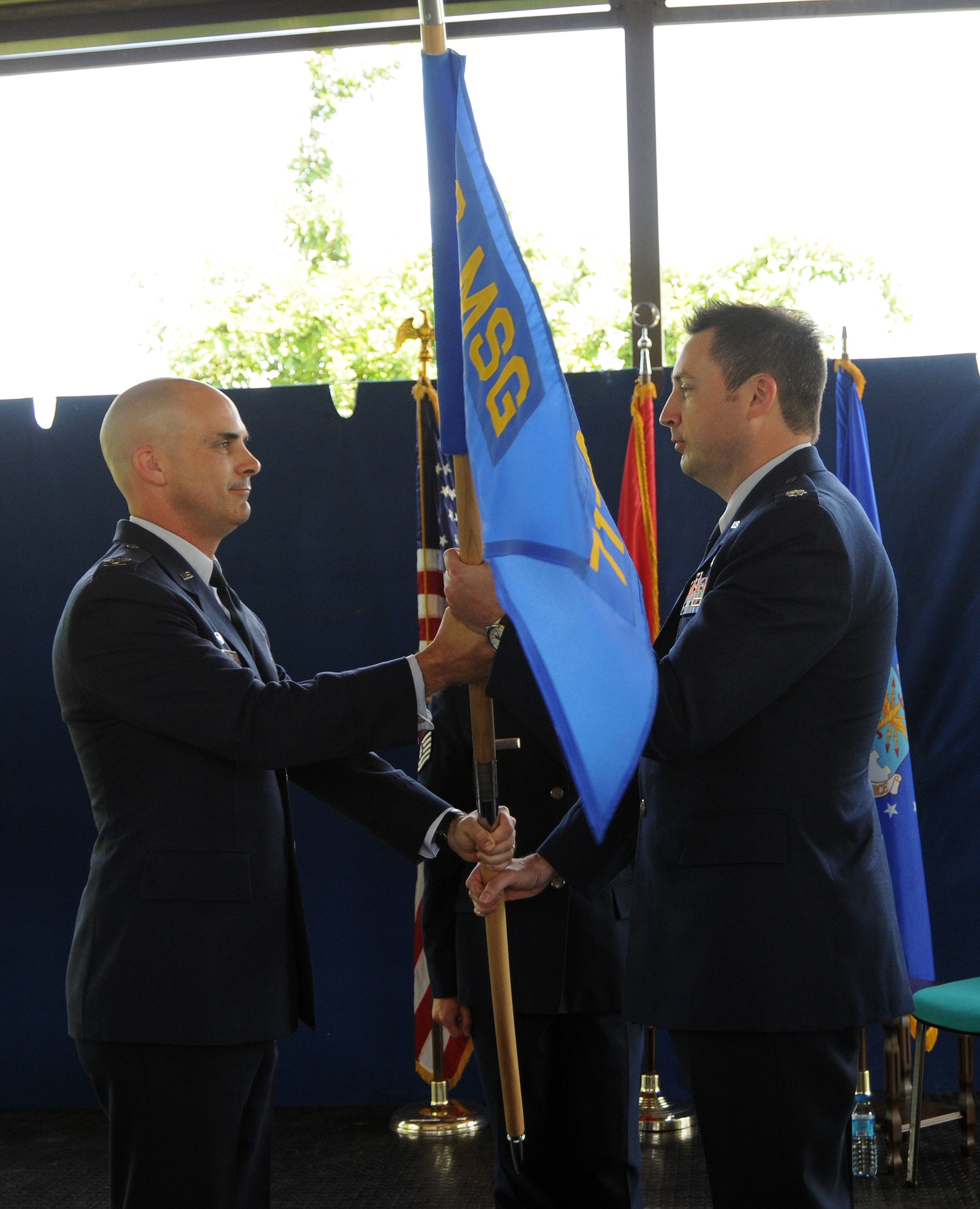 Col. Russell Voce, 39th Air Base Wing Mission Support Group commander (left), presents the guidon to Lt. Col. Mack Coker, 717th Air Base Squadron commander (right), during the 717th ABS change of command ceremony June 2, 2015 at the Ankara Support Facility, Turkey. A change of command ceremony is a tradition that represents a formal transfer of authority and responsibility from the outgoing commander to the incoming commander. (U.S. Air Force photo/1st Lt Leah Davis) (Released)