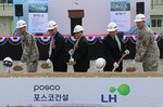 Ground was broken for the new "downtown" area, featuring a new Exchange, commissary and bowling center among other facilities, at Camp Humphreys, South Korea, Aug. 11, 2014. The project will also see the construction of an auditorium, chapel, chapel family life center, an arts & crafts center, recreation center, plaza and parking. When completed, these facilities will provide retail shopping, groceries, entertainment, recreation and religious services. 