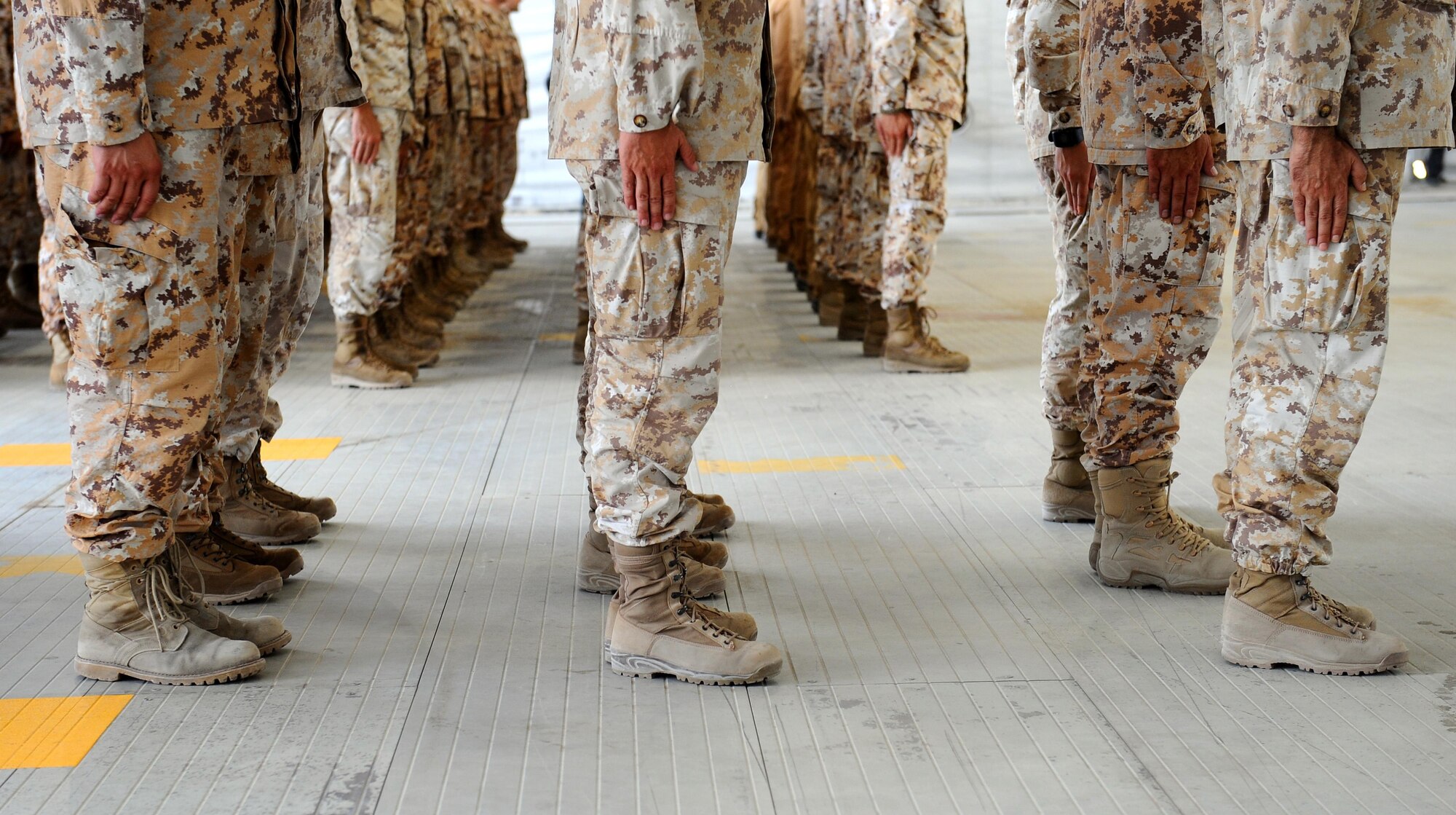 Members of the Aeronautica Militare, or Italian Air Force, stand in formation while Roberta Pinotti, Italian Minister of Defence, speaks during a brief visit to Southwest Asia, July 14, 2015. Pinotti viewed the progress of the base build up and learned more about Italian support to Operation Inherent Resolve. (U.S. Air Force photo/Tech. Sgt. Brittany E. Jones)