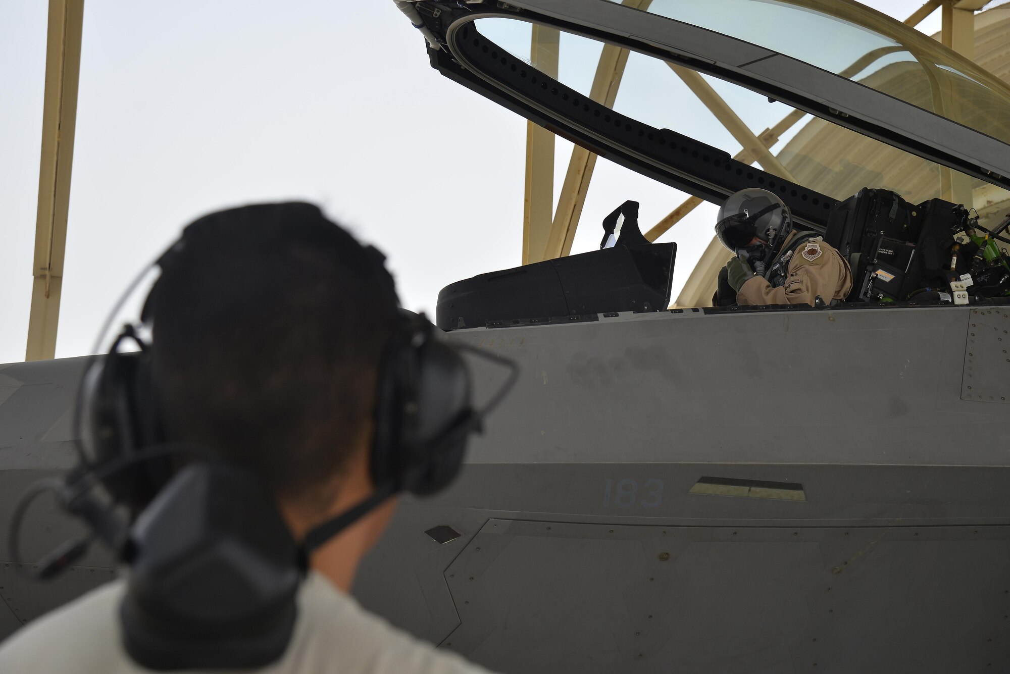 An F-22 Raptor pilot conducts prelaunch procedures at an undisclosed location in Southwest Asia July 9, 2015. The F-22’s combination of sensor capability, integrated avionics, situational awareness, and weapons provides first-kill opportunity against threats. (U.S. Air Force photo/Tech. Sgt. Christopher Boitz)
