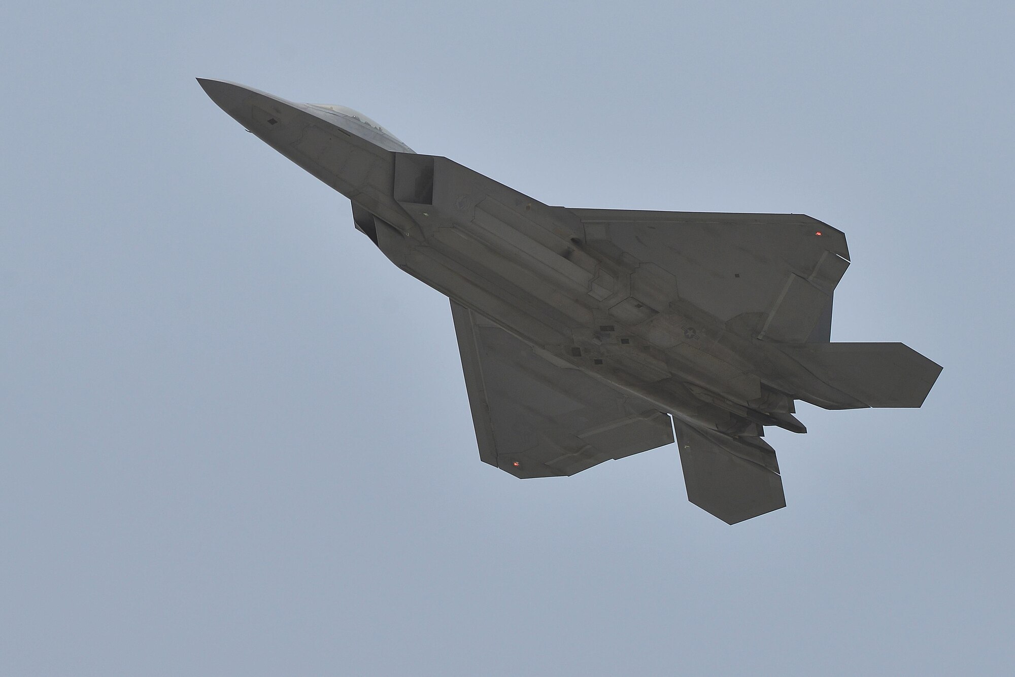 An F-22 Raptor launches from the runway at an undisclosed location in Southwest Asia July 9, 2015. The F-22’s combination of sensor capability, integrated avionics, situational awareness, and weapons provides first-kill opportunity against threats. (U.S. Air Force photo/Tech. Sgt. Christopher Boitz)