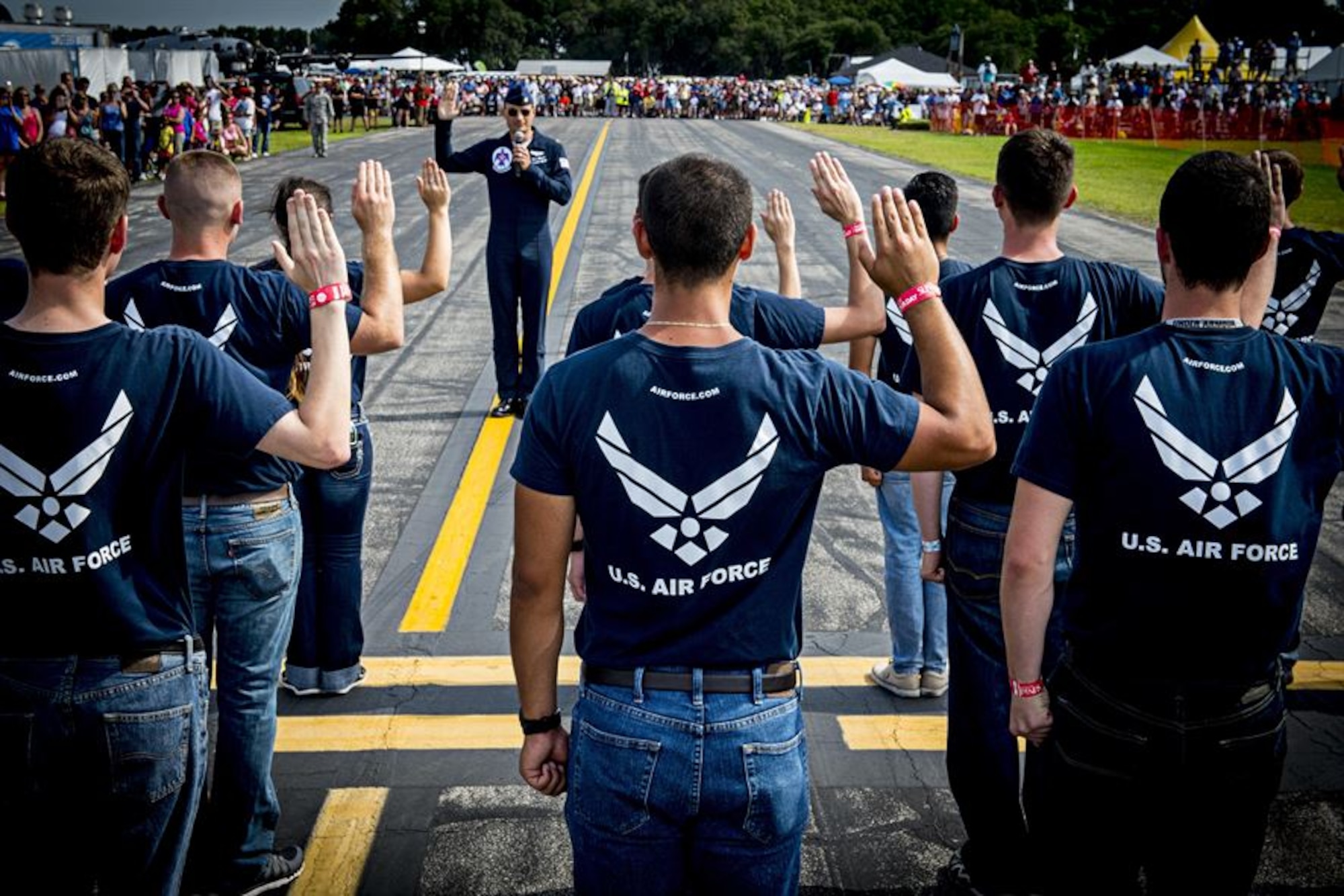 New Airmen take the Oath of Enlistment to at an airshow in  Lakeland, Fla., April, 25, 2015. An Air Education and Training Command oversight initiative works to protect Airmen in training following the discovery of unprofessional behavior within the Basic Military Training environment.  Through this initiative, Air Force leaders help ensure better transparency and accountability and gather information necessary to proactively shape professional expectations for its Airmen. 
