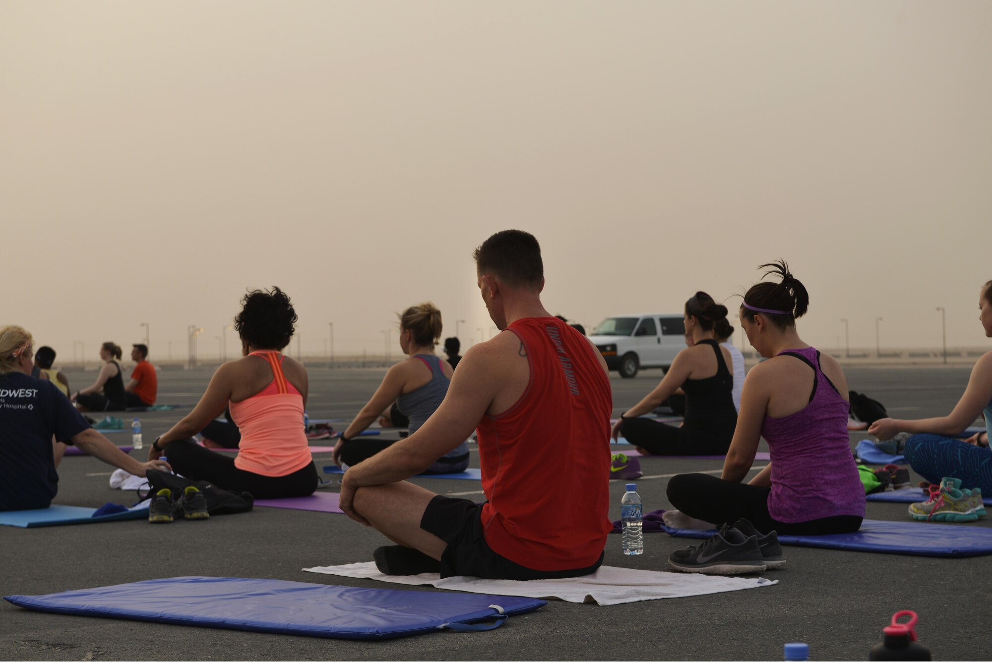 Deployed Soldiers, sailors, airmen, marines, coalition partners and civilians go relax as they finish the largest Yoga session to take place in Qatar history July 11, 2015 Al Udeid Air Base, Qatar. This event opened its doors to all levels of practitioners from novice to expert. It allowed the fine men and women assigned to Al Udeid Air Base to relax and enjoy a different kind of exercise in a neutral environment. (U.S. Air Force photo/Staff Sgt. Alexandre Montes)
