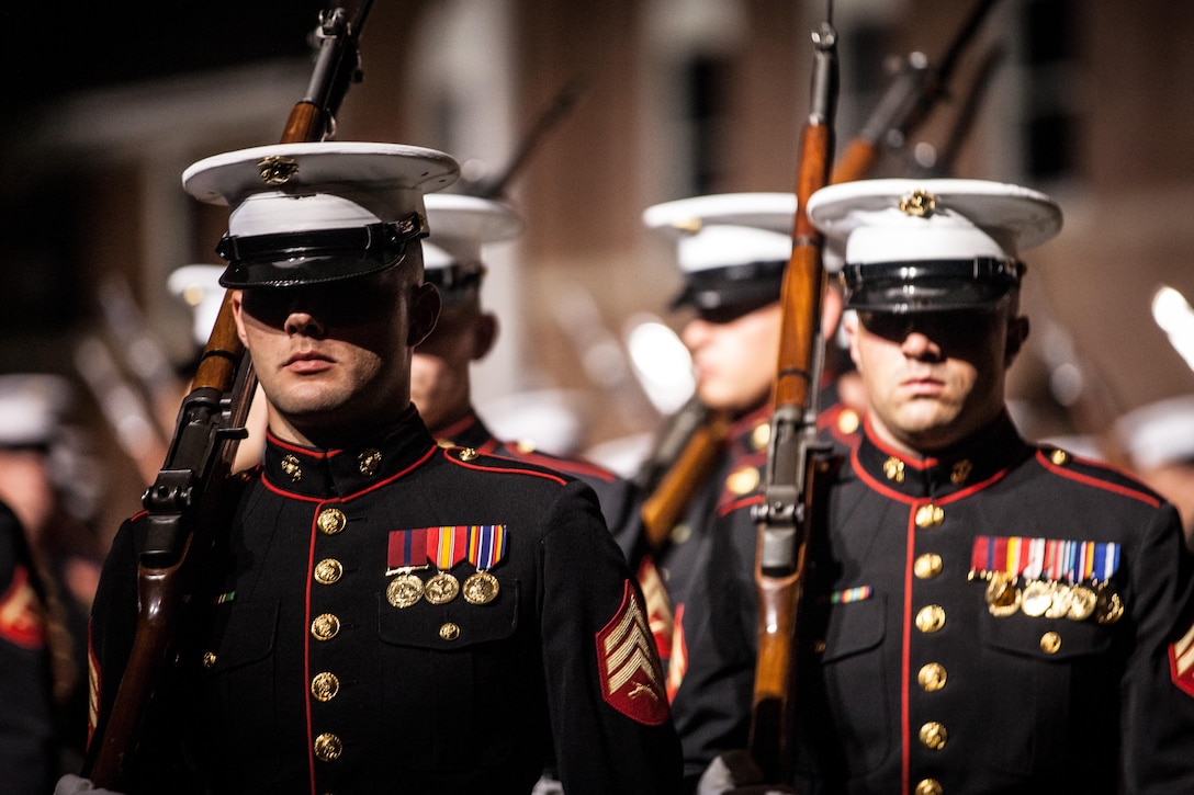 U.S. Marines with Marine Barracks Washington, D.C. perform during an Evening Parade at MBW, D.C., July 10, 2015. Gen. Joseph Dunford Jr., commandant of the Marine Corps, was the hosting official for the July 10 Evening Parade, and the Guests of Honor were eight congressional Marines, to include Sen. Charles Roberts, Sen. Daniel Sullivan, Rep. John Kline, Rep. Michael Coffman, Rep. Scott Rigell, Rep. Paul Cook, Rep. Mike Bost, and Rep. Ruben Gallego. (U.S. Marine Corps photo by Sgt. Melissa Marnell/Released)