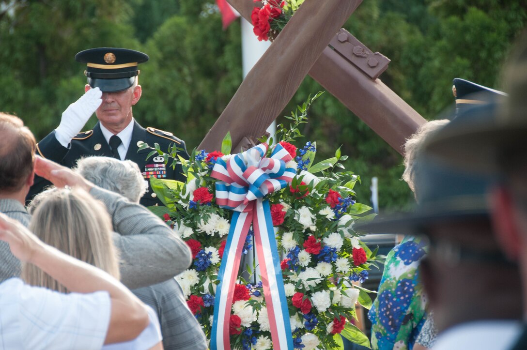 Retired Command Sergeant Major Marty Wells, renders honors after the memorial wreath is presented during the 9/11 First Responders Remembrance Memorial at the Columbia Metropolitan Convention Center Sept. 11. The First Responders Remembrance Memorial was built in 2011, integrating two 9/11 historic World Trade Center steel beams from Tower one.  It includes all South Carolina Midlands firefighters, law enforcement, emergency medical services and all branches of the military that have lost their lives in the line of duty since Sept. 11. (U.S. Army photo by Sgt. Kandi Huggins, 81st Regional Support Command Public Affairs)