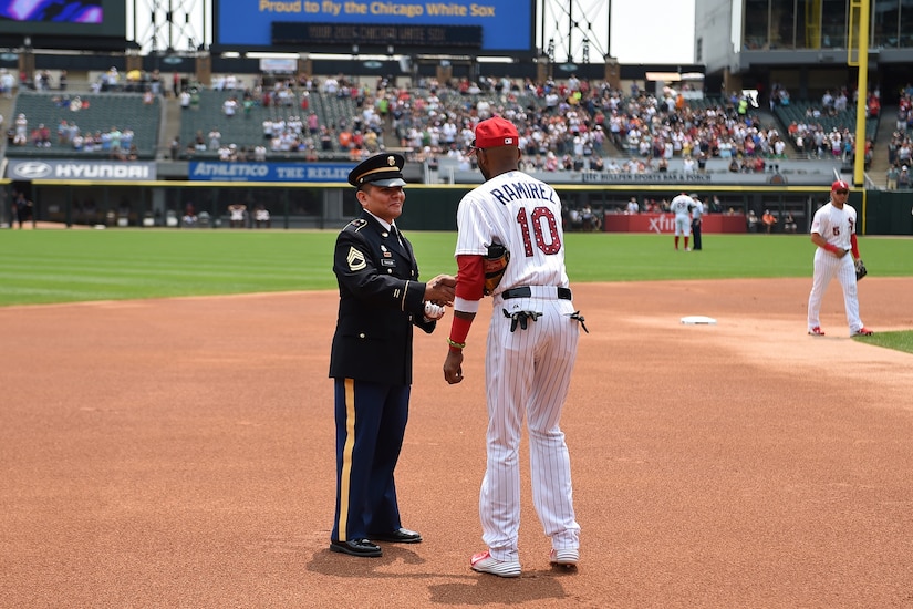 Army Reserve Sgt. 1st Class Anthony L. Taylor meets Alexei Ramirez, White Sox shortstop, during the Chicago White Sox vs. Baltimore Orioles game at U.S. Cellular Field, July 4. Service members from each branch of service were honored on the field during the game in front of an audience of more than 22,000 during the Independence Day celebrations. (U.S. Army photo by Spc. David Lietz/Released)