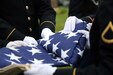 Army Reserve soldiers from the Chicago land area conduct a flag folding ceremony for the family of Army Sgt. Lawrence V. Blanchet, WWII Veteran, who was killed in action on the Italian front while serving with the 92nd Infantry “Buffalo” Division in 1945. During the ceremony the Blanchet family received Blanchet’s Silver Star in a formal presentation as well as a U.S. flag. The ceremony also included three volleys of shots fired, taps played and a flag folding presentation. (U.S. Army photo by Anthony L. Taylor/Released)