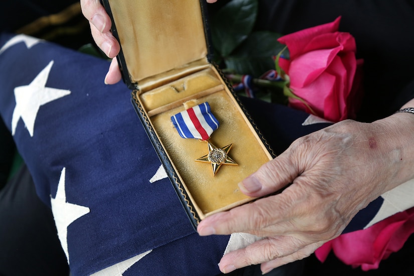The family of Army Sgt. Lawrence V. Blanchet, WWII Veteran, who was killed in action on the Italian front while serving with the 92nd Infantry “Buffalo” Division in 1945 displays Sgt. Blanchet’s Silver Star following a formal military ceremony presenting the award. During the ceremony the family received Sgt. Blanchet’s Silver Star in a formal presentation as well as a U.S. flag. The ceremony also included three volleys of shots fired, taps played and a flag folding presentation. Army Reserve soldiers from throughout the Chicago land area came together to conduct the ceremony for the Blanchet family.

(U.S. Army photo by Anthony L. Taylor/Released)